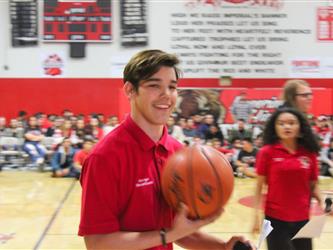 Student holding a basketball